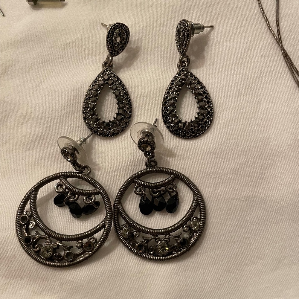 Elegant black earrings with intricate design.